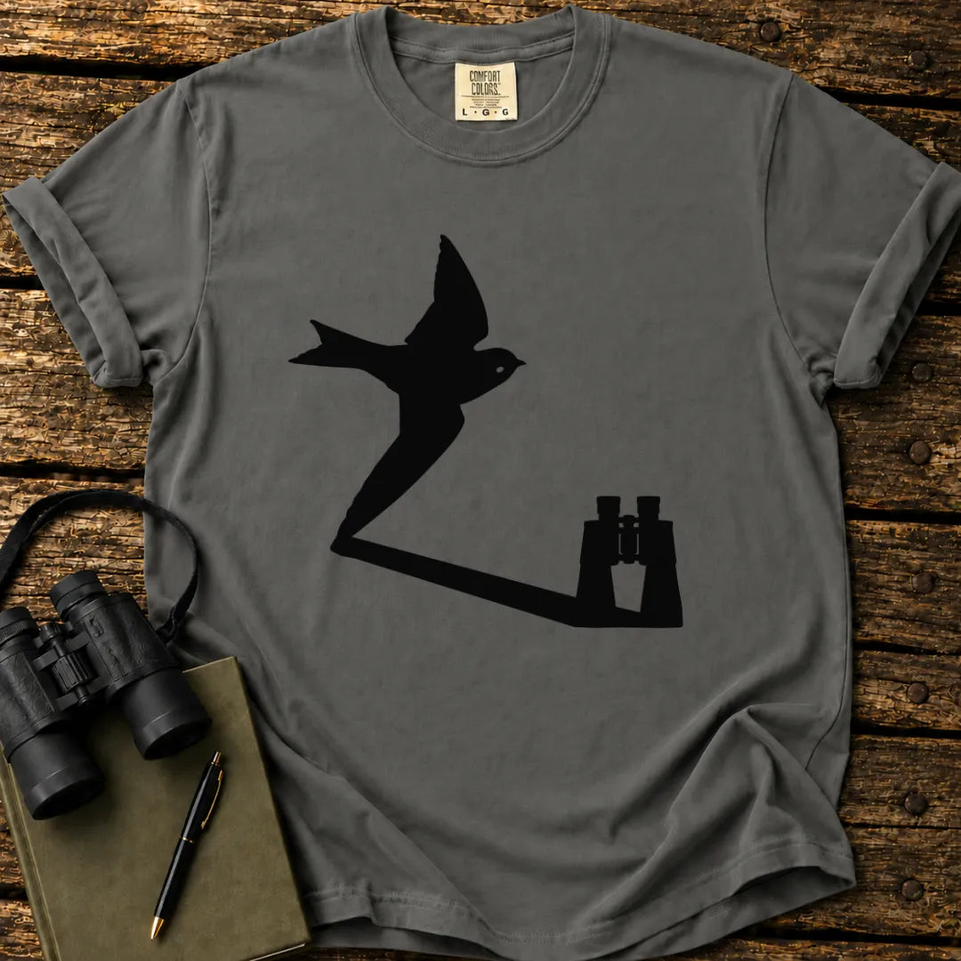 Illustrated Swallow viewed through binoculars on a graphic t-shirt